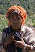 Žena z etnika Munn Chin. Dekorativní tetování tváře pokračuje až na krk. Provincie Chin. Myanmar (Barma).